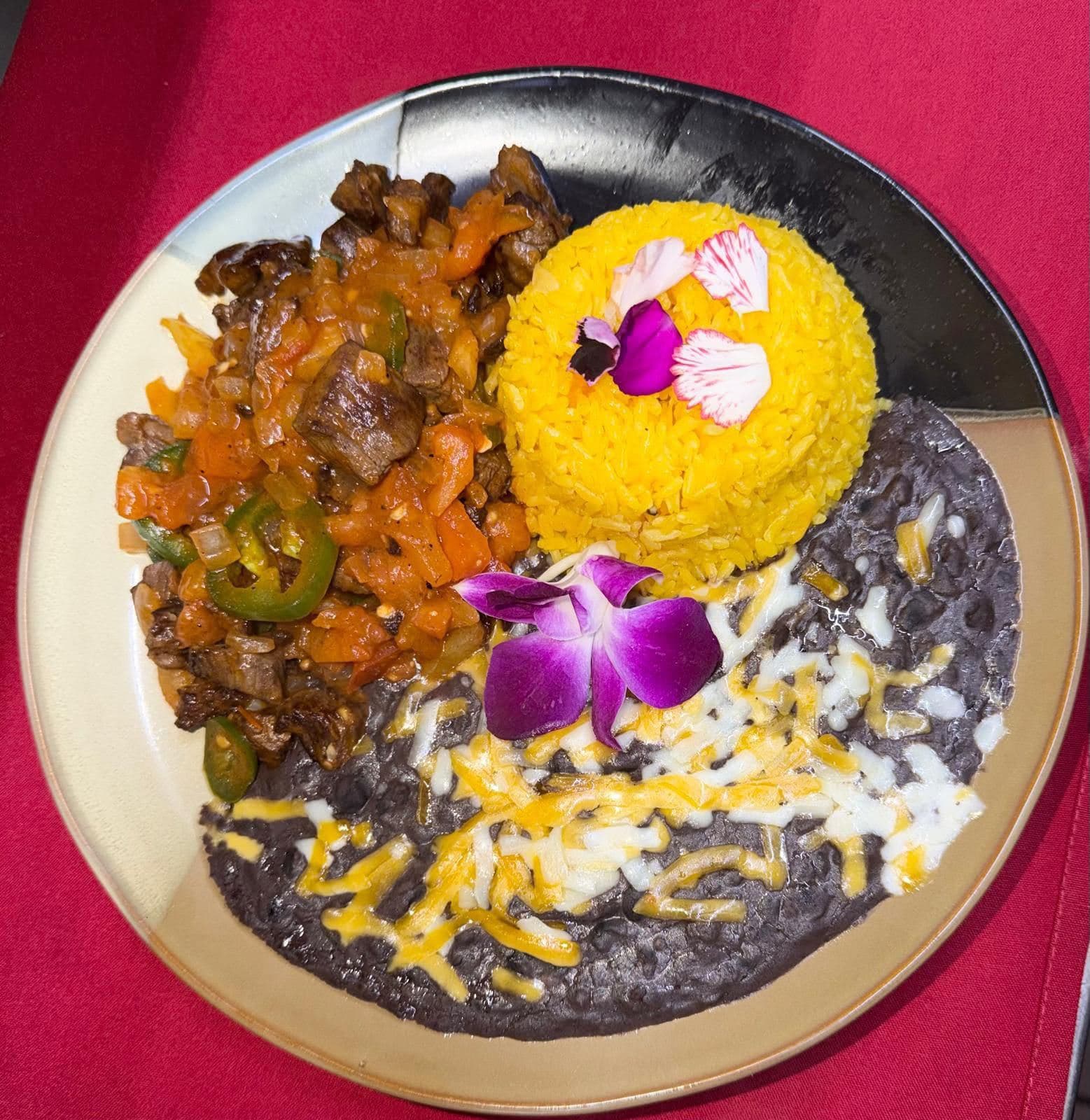 Stewed beef with yellow rice and black beans