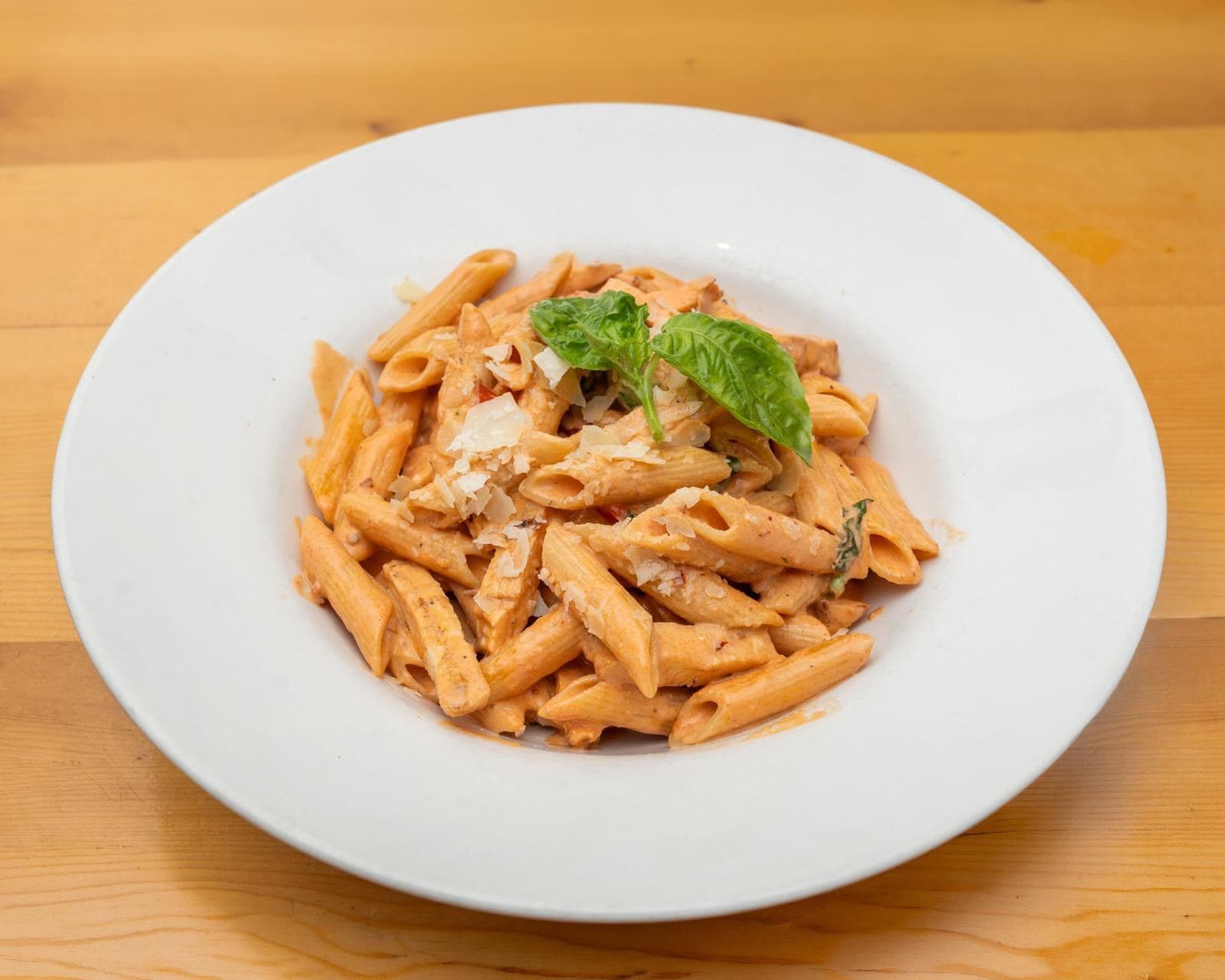 Penne in a creamy pink vodka sauce with basil